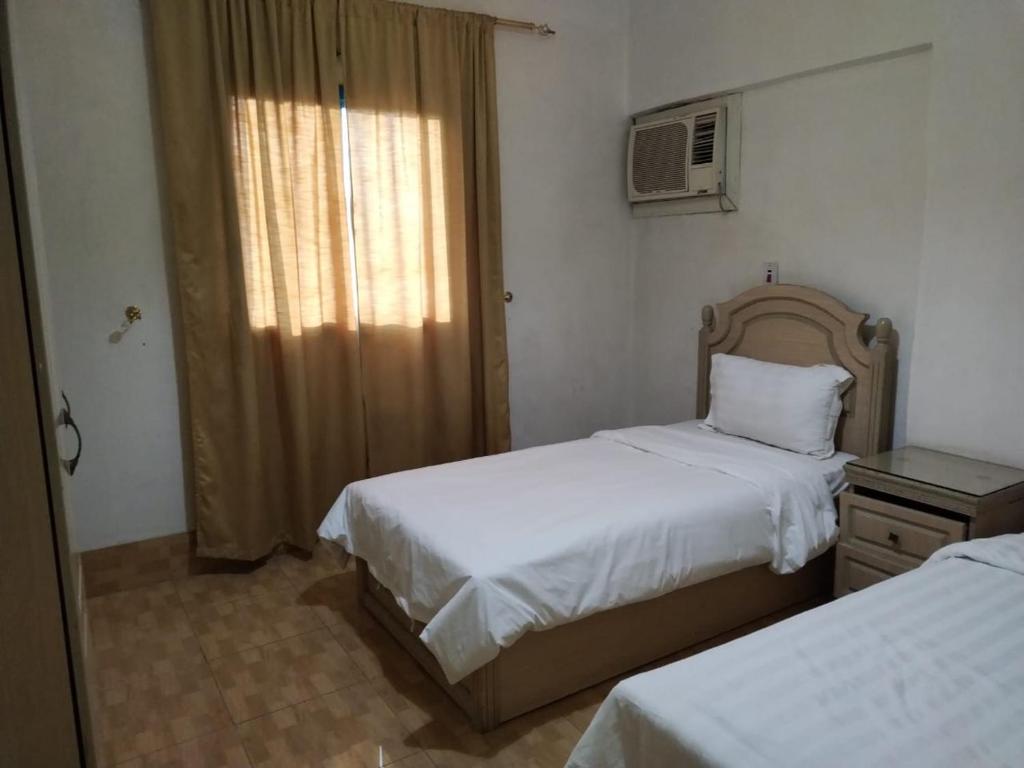 Postel nebo postele na pokoji v ubytování الحسناء 2