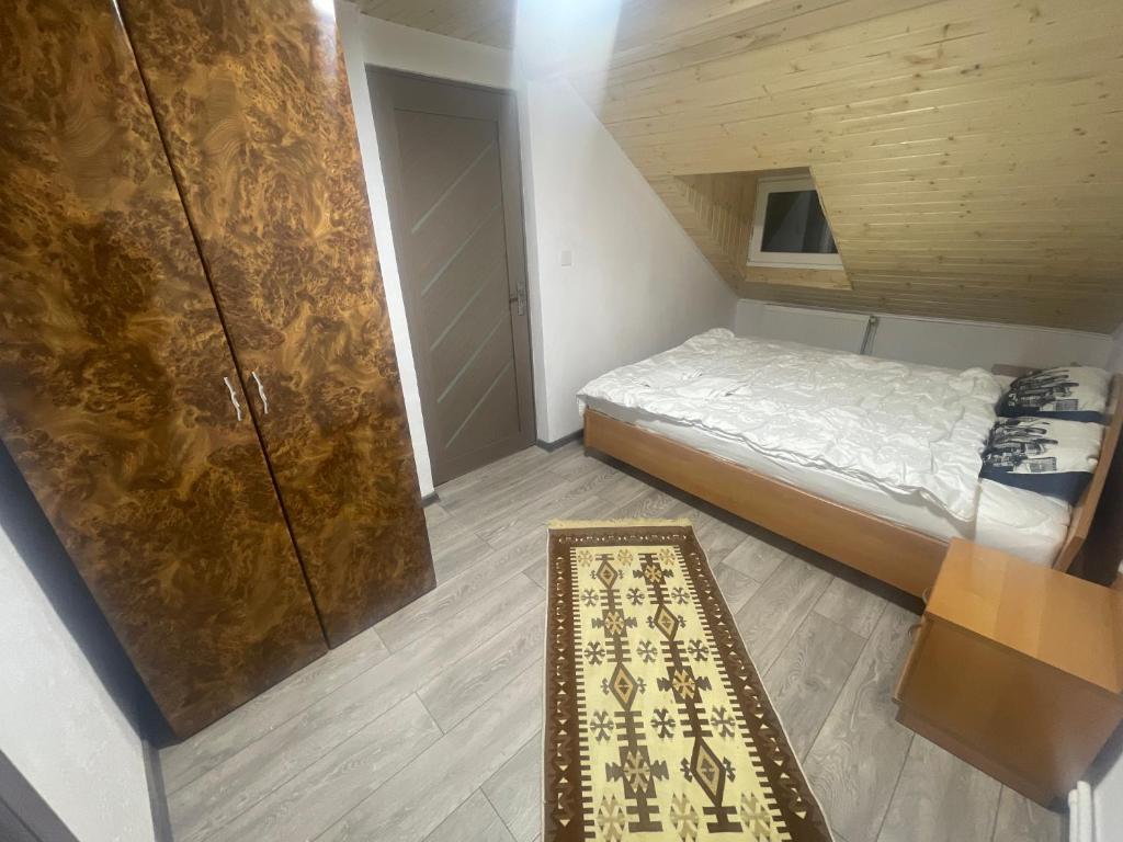 Postel nebo postele na pokoji v ubytování Vila Rustik Straja