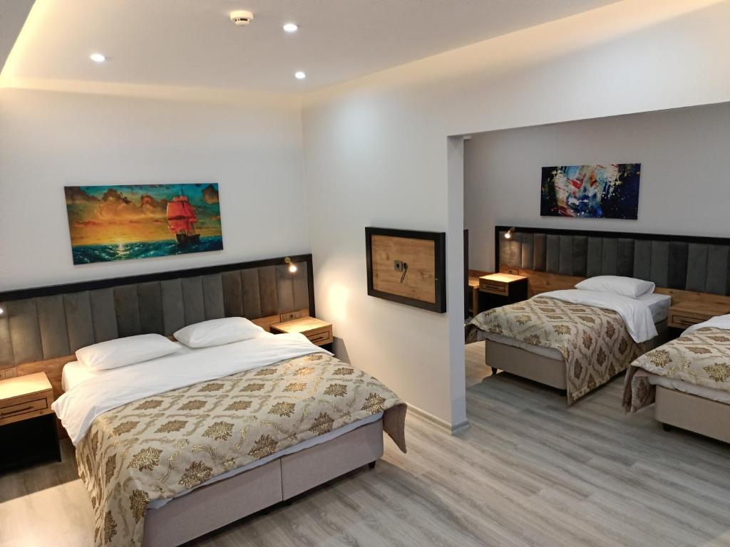 A bed or beds in a room at The Marine Hotel