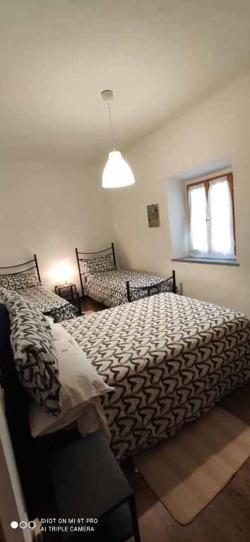 Postel nebo postele na pokoji v ubytování Casa Zito CIN it04041c287ii6uk