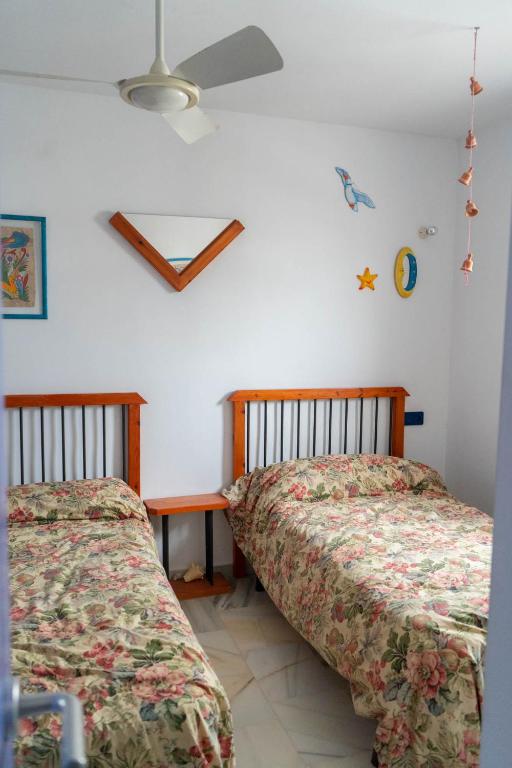 Posteľ alebo postele v izbe v ubytovaní Casa de la Rosa