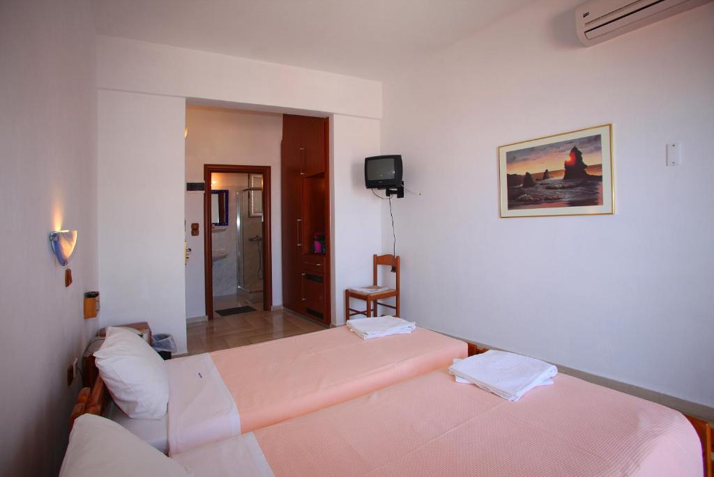 Postel nebo postele na pokoji v ubytování Denise Hotel