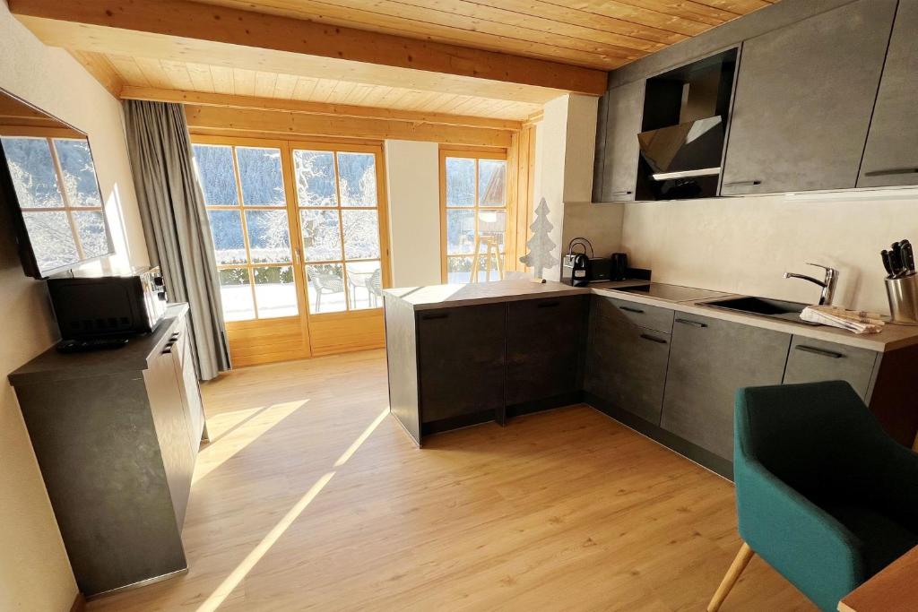 Kuchyň nebo kuchyňský kout v ubytování Apartmenthaus Matri by Pferd auf Wolke