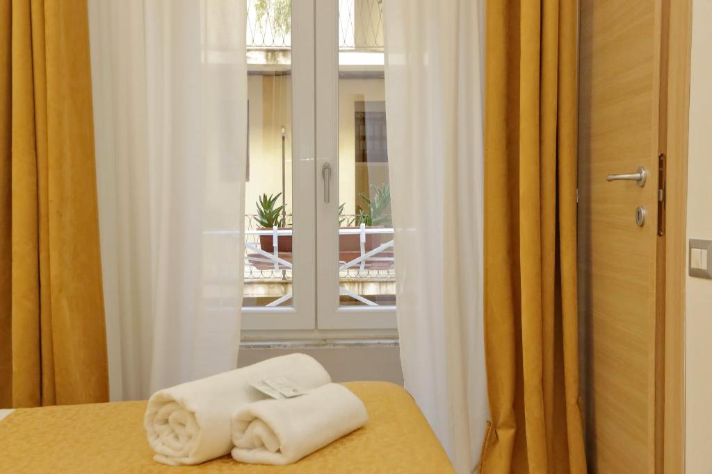 Posteľ alebo postele v izbe v ubytovaní Dream City Rome