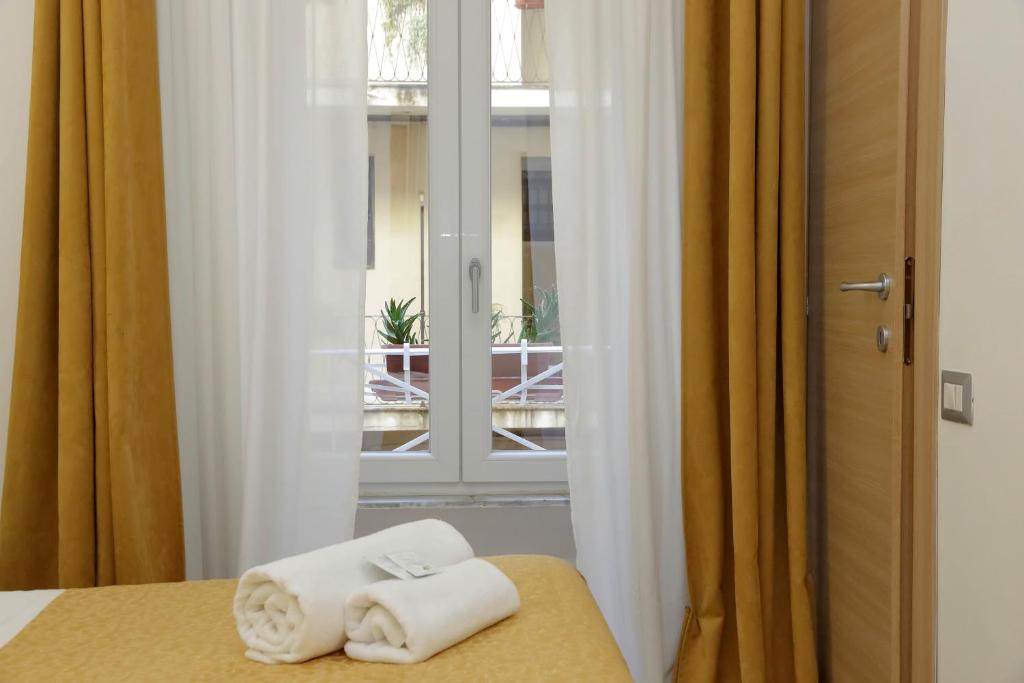 Posteľ alebo postele v izbe v ubytovaní Dream City Rome