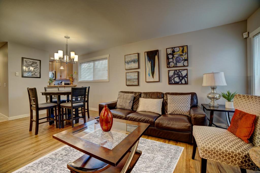 a living room with a couch and a table at Cozy 2 Bedroom Townhouse in Northgate in Seattle