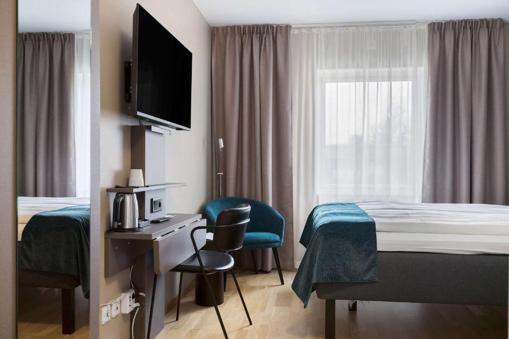 TV a/nebo společenská místnost v ubytování Best Western Hotel Vidöstern
