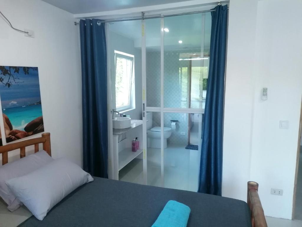 Postel nebo postele na pokoji v ubytování Villa Jana, Bantayan, Santa Fe