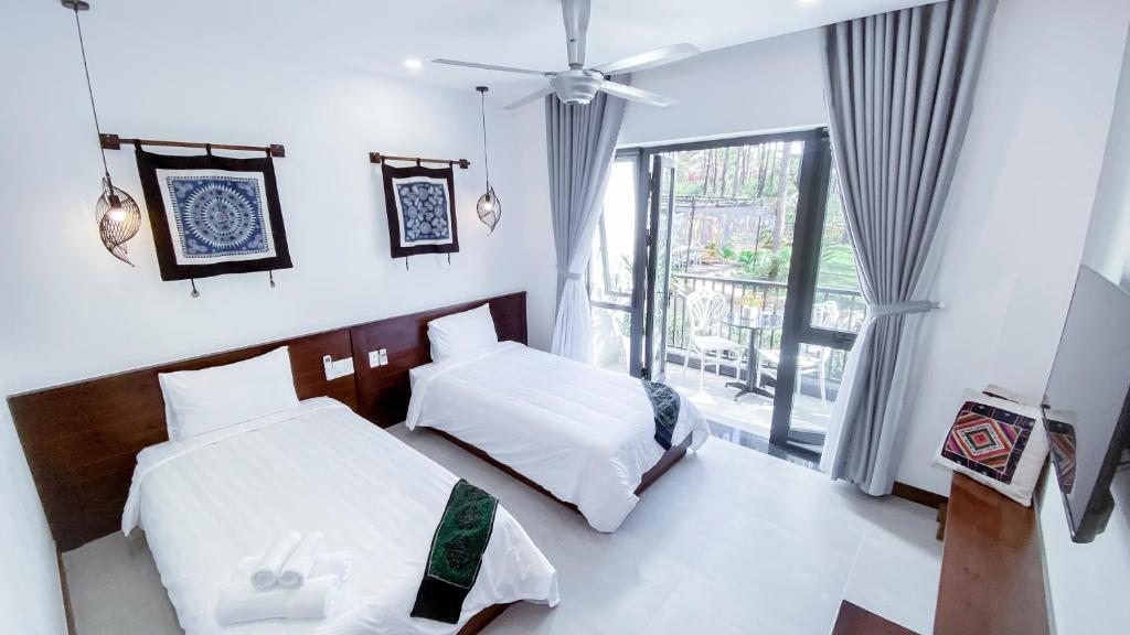 Un pat sau paturi într-o cameră la Casa Vanilla Mang Den