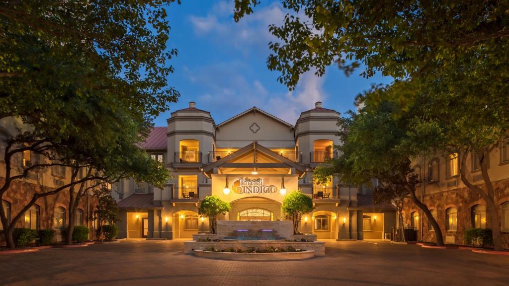 a large building with a fountain in front of it at Hotel Indigo San Antonio Riverwalk by IHG in San Antonio