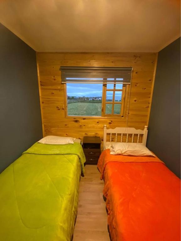 Postel nebo postele na pokoji v ubytování Cabañas del Llano