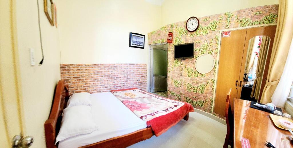 Postel nebo postele na pokoji v ubytování Bình Đào Hotel - Khách sạn ngay trung tâm giá rẻ