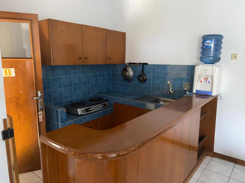 Kuchyň nebo kuchyňský kout v ubytování Hotel Puspa Sari