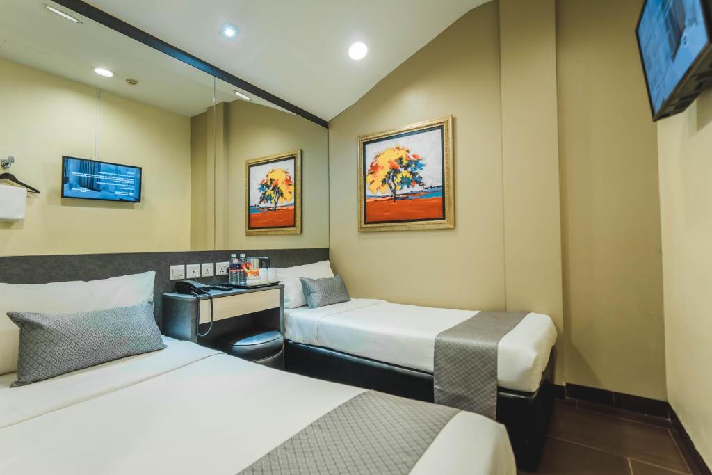 Postel nebo postele na pokoji v ubytování Value Hotel Nice
