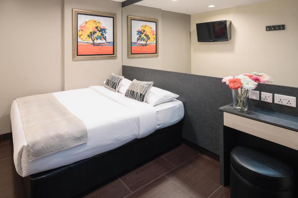 Postel nebo postele na pokoji v ubytování Value Hotel Nice