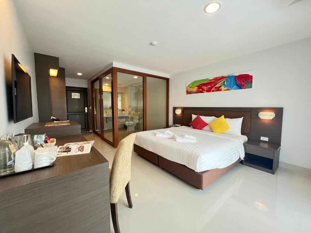 Postel nebo postele na pokoji v ubytování Riche Hua Hin Hotel - SHA Plus