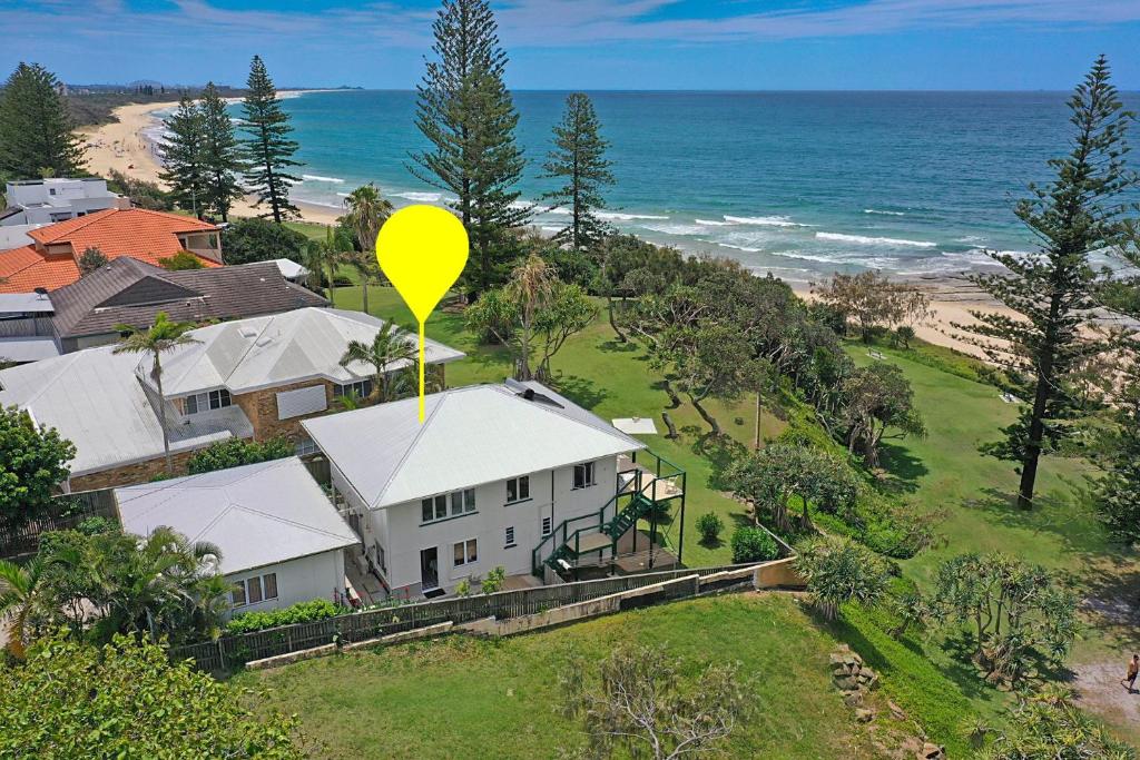 a yellow balloon is sitting on top of a house at 35 Wilson Avenue Dicky Beach QLD in Caloundra