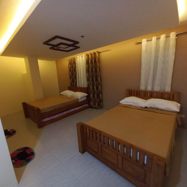 Postel nebo postele na pokoji v ubytování Visita highland Inn