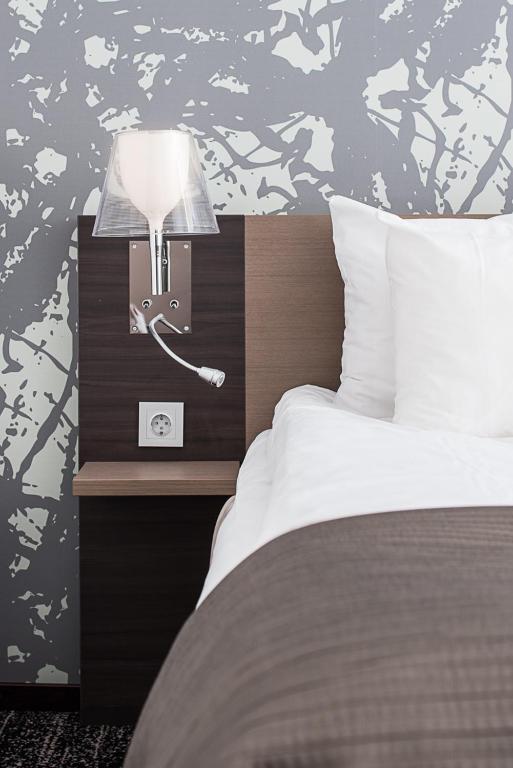 Postel nebo postele na pokoji v ubytování Quality Hotel Luleå