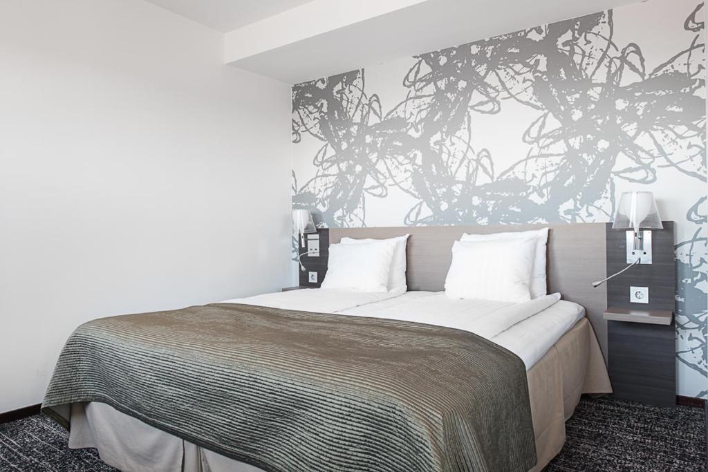 Postel nebo postele na pokoji v ubytování Quality Hotel Luleå