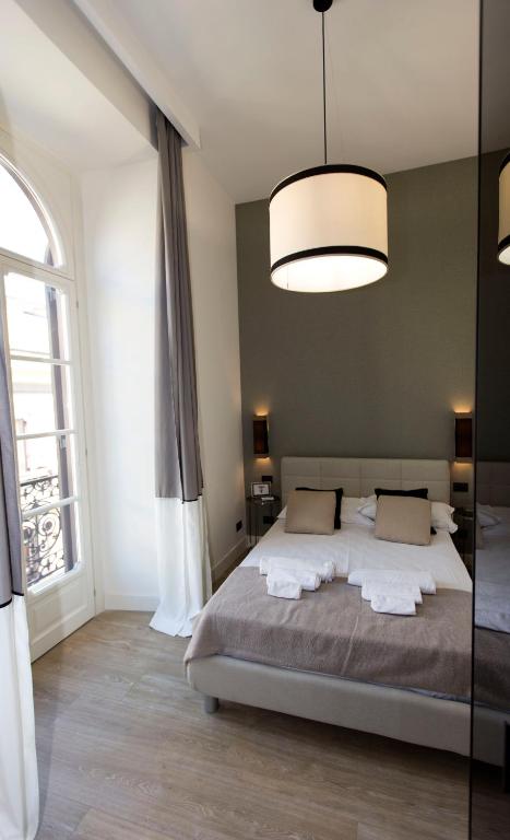 Posteľ alebo postele v izbe v ubytovaní N A P Experience Apartments