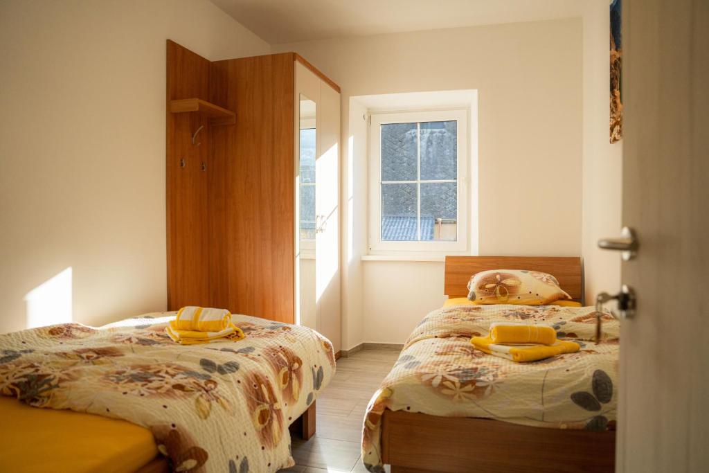 Postel nebo postele na pokoji v ubytování Relax House Soča