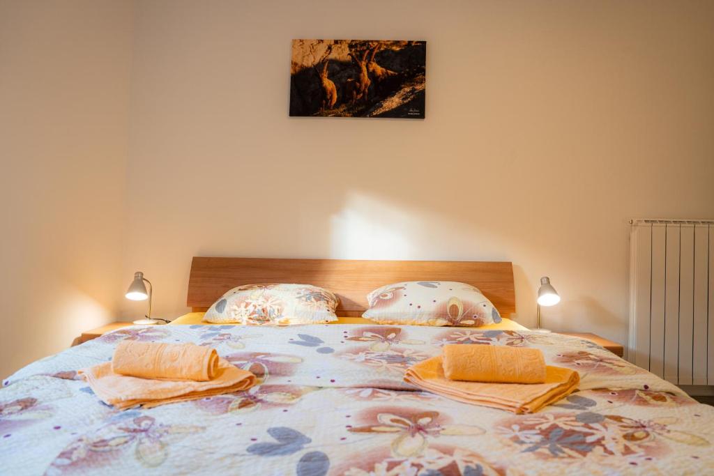 Postel nebo postele na pokoji v ubytování Relax House Soča