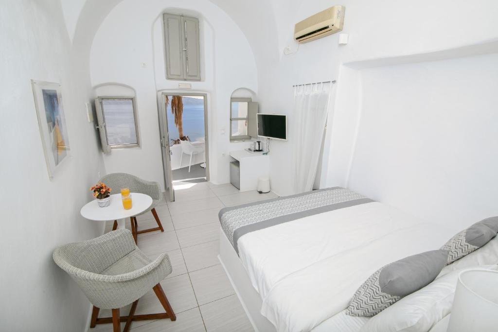 Postel nebo postele na pokoji v ubytování Vogue Suites