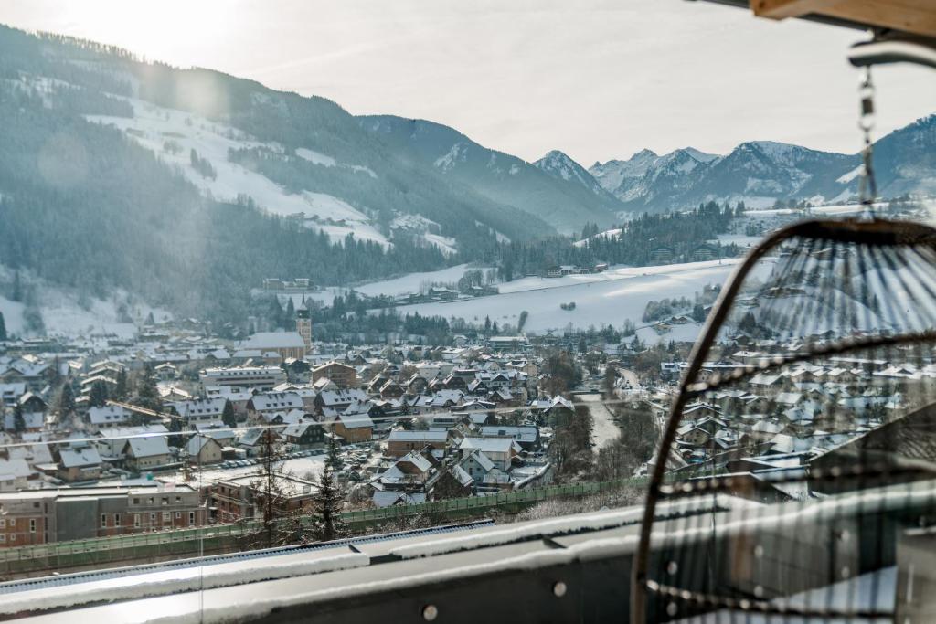 a view of a town in the snow from a gondola at Apartmentresort MyLodge in Schladming