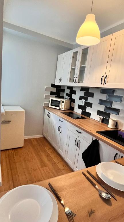 Kuchyňa alebo kuchynka v ubytovaní Apartament z widokiem na Spodek