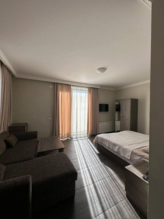 Postel nebo postele na pokoji v ubytování Villa Bakuriani