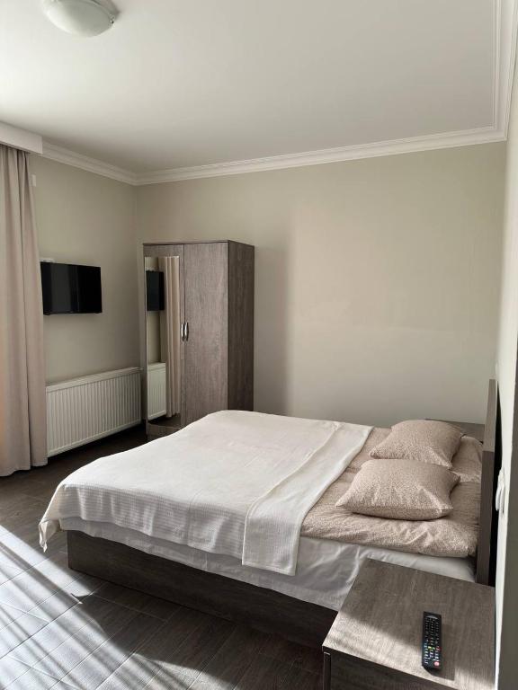 Postel nebo postele na pokoji v ubytování Villa Bakuriani