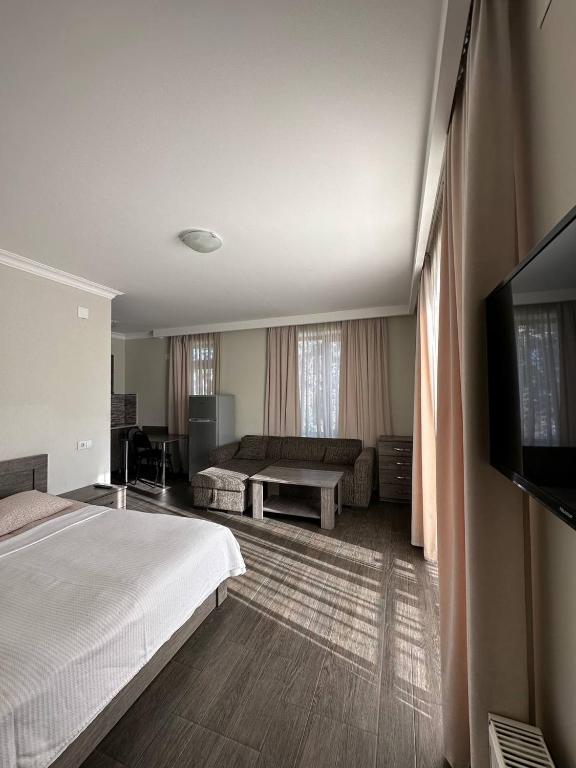 Postel nebo postele na pokoji v ubytování Villa Bakuriani