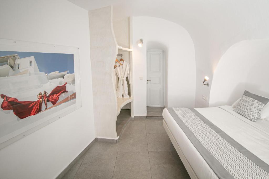 Postel nebo postele na pokoji v ubytování Vogue Suites