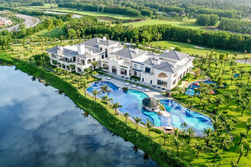 an aerial view of a large house with a swimming pool at Vinpearl Wonderworld Phu Quoc in Phú Quốc