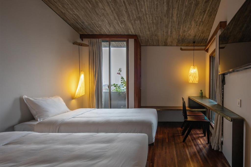 Postel nebo postele na pokoji v ubytování Concon house
