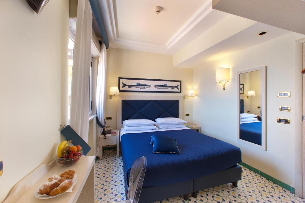 Postel nebo postele na pokoji v ubytování Hotel Del Mare