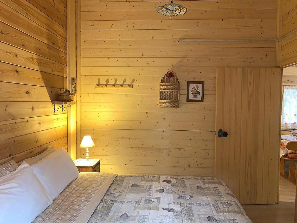 A bed or beds in a room at CHALET ETNA MILO