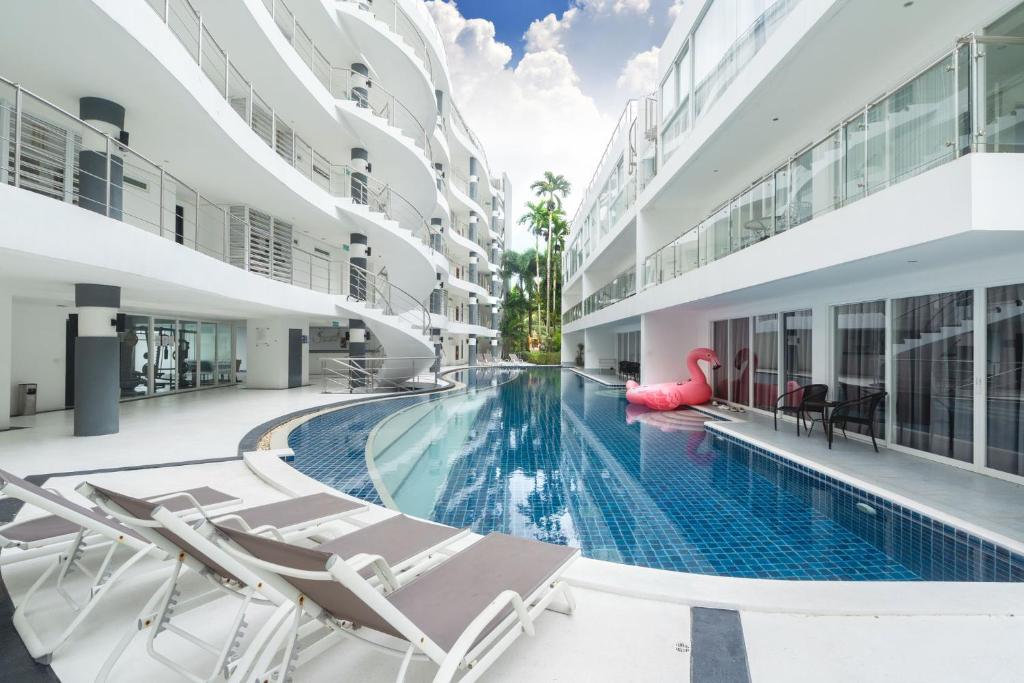 an image of a swimming pool in a building at sunset plaza condominium by Ryan, 600 meters to Karon Beach in Karon Beach