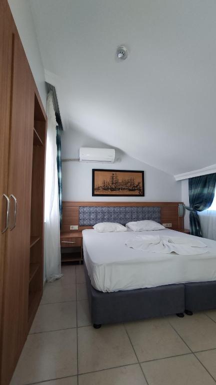 Postel nebo postele na pokoji v ubytování Wonder Life Hotel