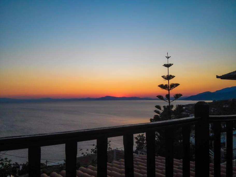 a view of the sunset from a balcony at Kalimera Villa, Afissos Pelion in Afissos