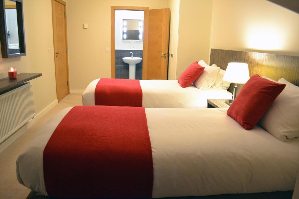 Postel nebo postele na pokoji v ubytování Carrick Plaza Suites and Apartments