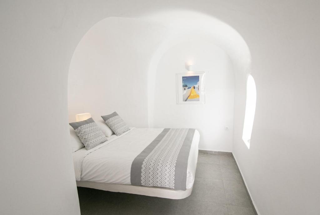 Postel nebo postele na pokoji v ubytování Vogue Suites