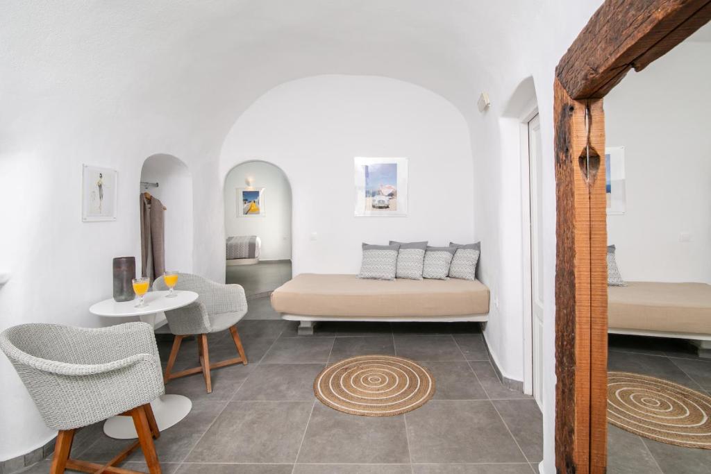 Postel nebo postele na pokoji v ubytování Vogue Suites