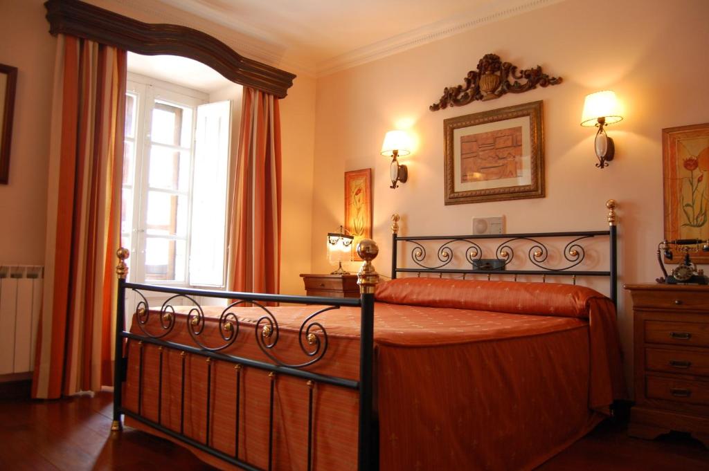 Postel nebo postele na pokoji v ubytování Posada Casa de don Guzman