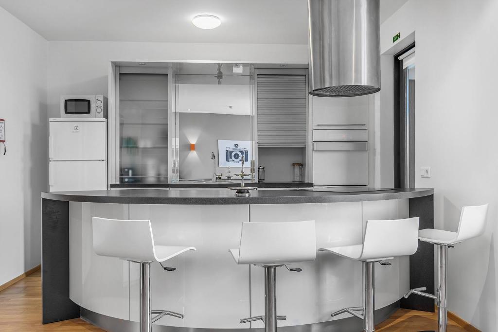 Kuchyň nebo kuchyňský kout v ubytování Sunny Apartment - By the Sea in City Center