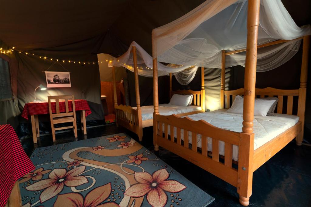 Postel nebo postele na pokoji v ubytování Talek Bush Camp , Masai Mara