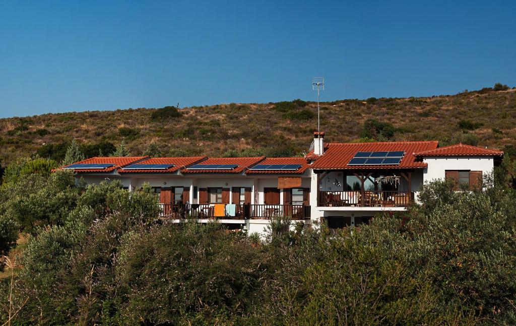 a house with solar panels on its roof at Kortiri Studios in Agios Nikolaos