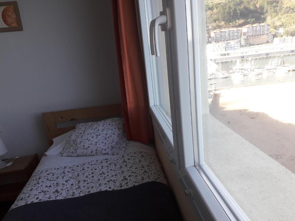 Postel nebo postele na pokoji v ubytování Arrigorri Ostatu Jatetxea