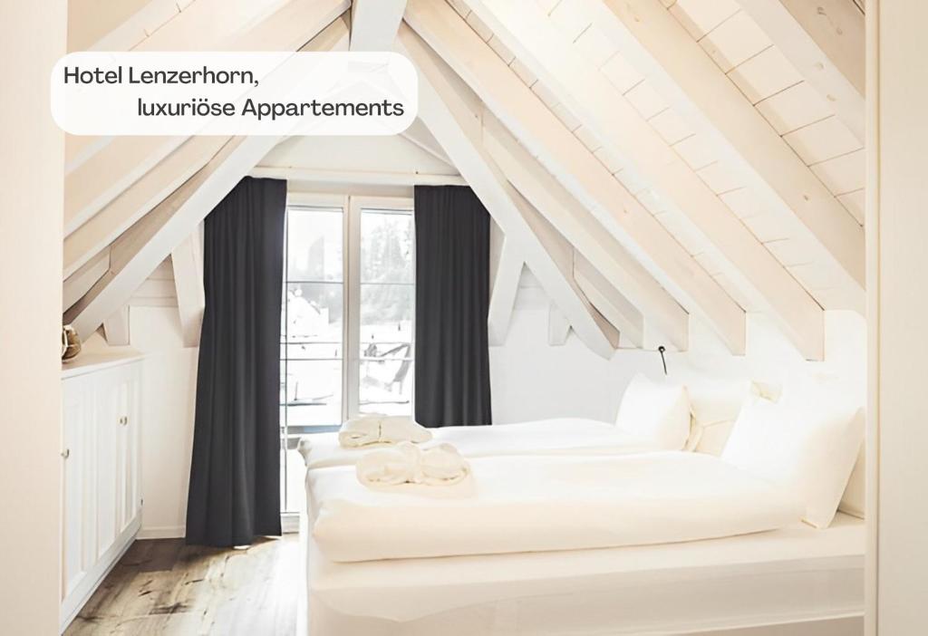 Postel nebo postele na pokoji v ubytování Hotel Lenzerhorn